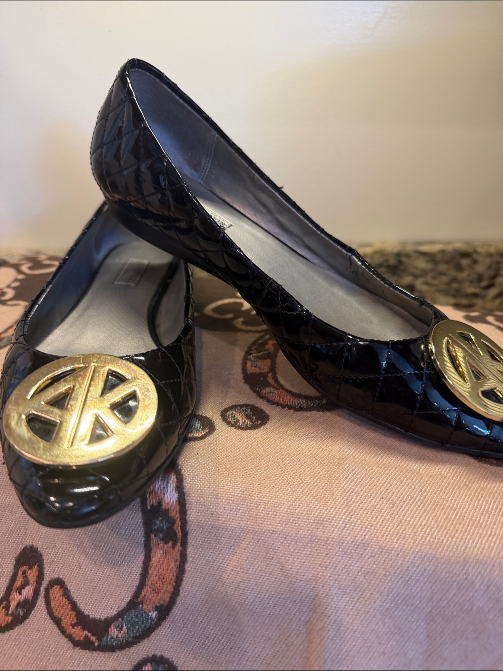 Anne Klein Black Patent Quilted Ballet Flats with Gold Logo Medallion